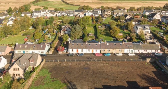 Slimline vertical sliding secondary glazing unit matching the meeting rails of a historic sash window in Stirlingshire.
