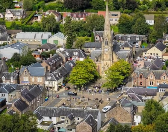 Slimline vertical sliding secondary glazing matching the original timber frames of a Trossachs heritage property.