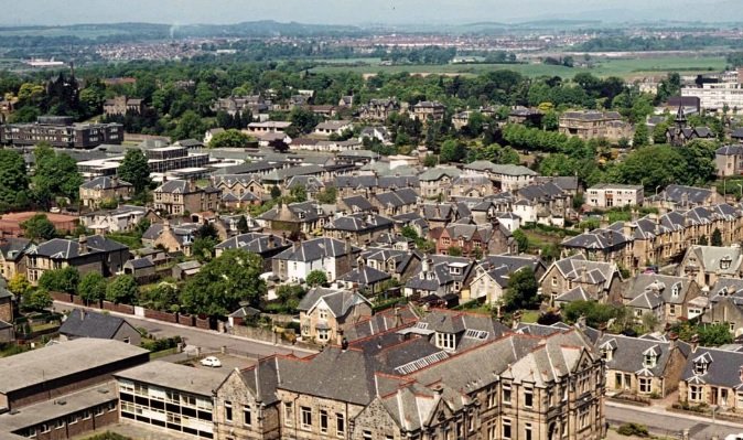 Slimline vertical sliding secondary glazing matching the meeting rails of an original timber sash window in Falkirk.
