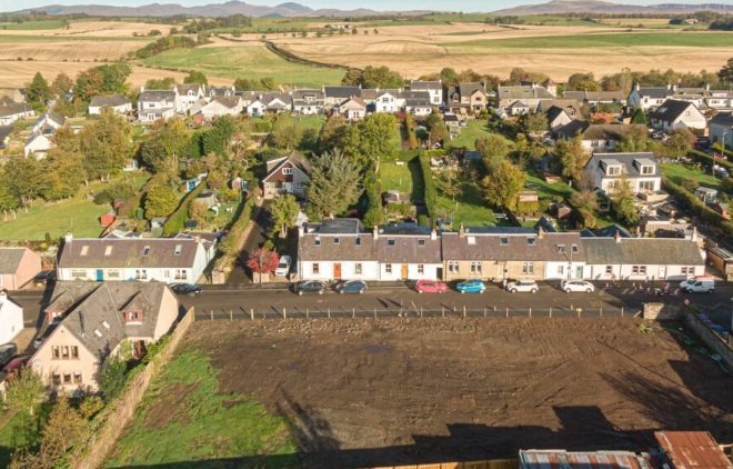 Slimline vertical sliding secondary glazing matching the original timber frames of a historic Gartmore Stirlingshire cottage.