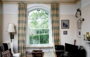 Internal view of discreet secondary glazing installed for noise reduction in a period home