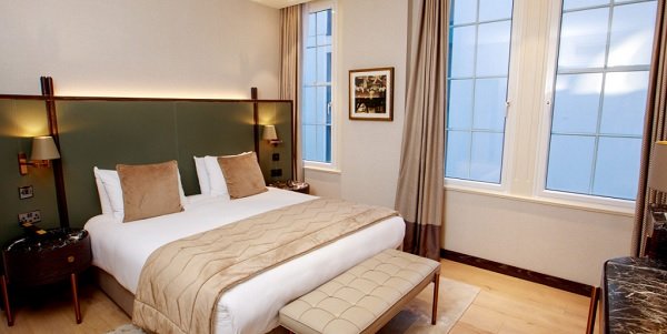 A side-by-side comparison showing the thermal air gap of secondary glazing vs triple glazing for energy efficiency.